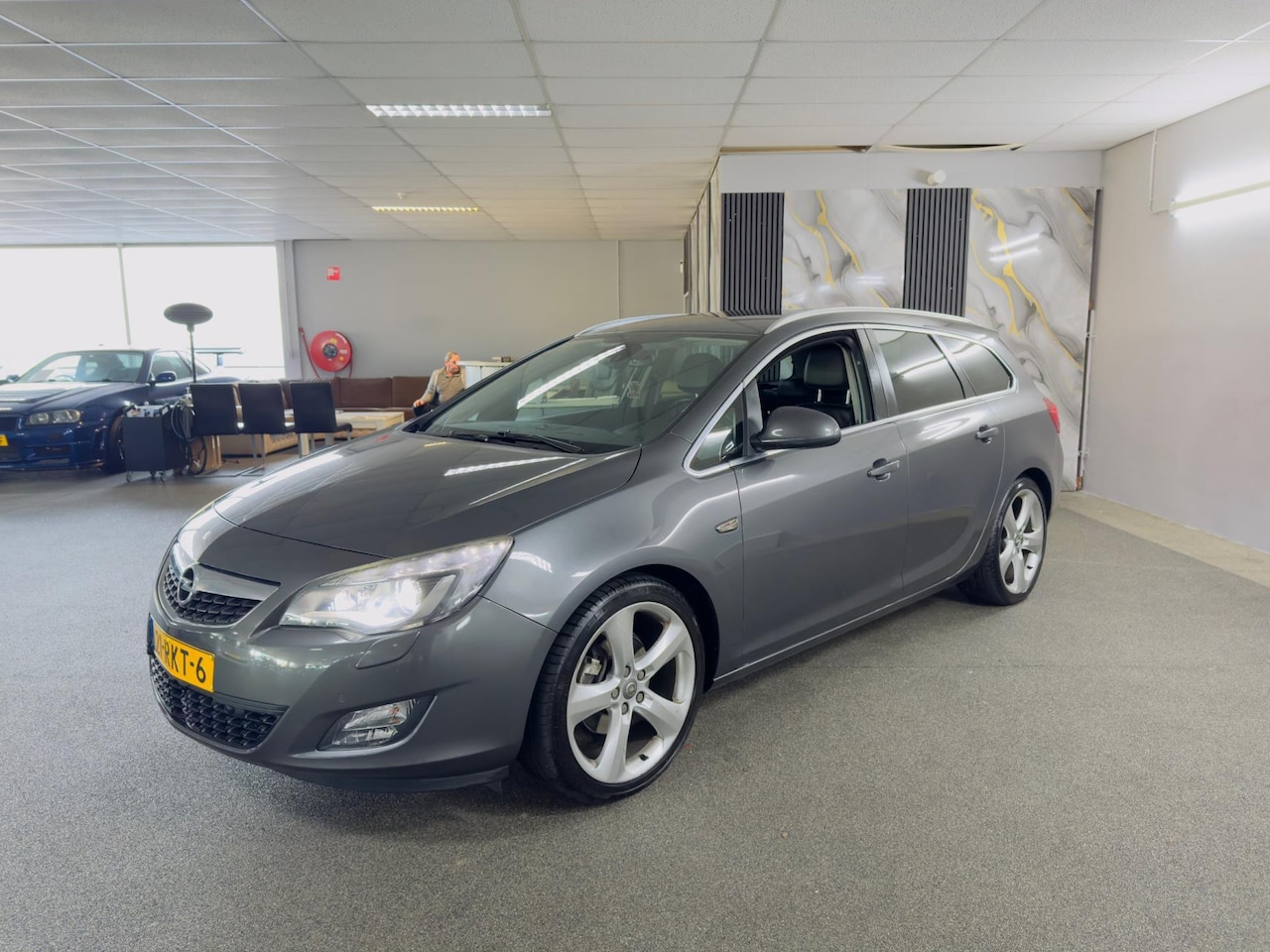 Opel Astra Sports Tourer - 1.6 Turbo Sport 1.6 Turbo Sport,Clima,Cruise,Xenon,Carplay,Vol Leder,Stoelverwarming,Parksensoren,Vol Opti - AutoWereld.nl