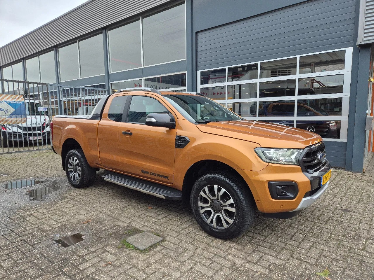 Ford Ranger - 2.0 TDCI 4X4 BiTurbo WildTrak/ Leer/ Navi/ Camera/ Full Option - AutoWereld.nl