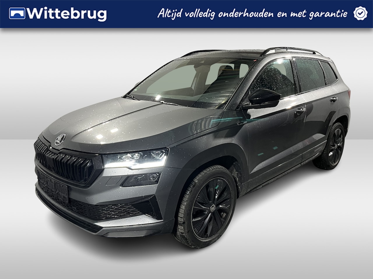Skoda Karoq - 1.5 TSI ACT Sportline Business / AUTOMAAT/ SMARTLINK/ PARK. SENSOREN + CAMERA/ LED/ NAVI/ - AutoWereld.nl