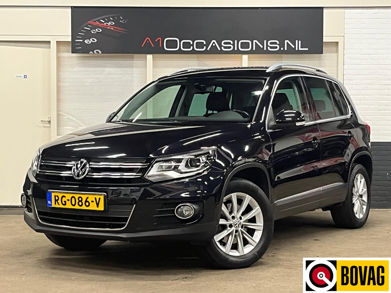 Volkswagen Tiguan - 2.0 TSI Sport&Style 4Motion + STOELVERWARMING + NAVI - AutoWereld.nl