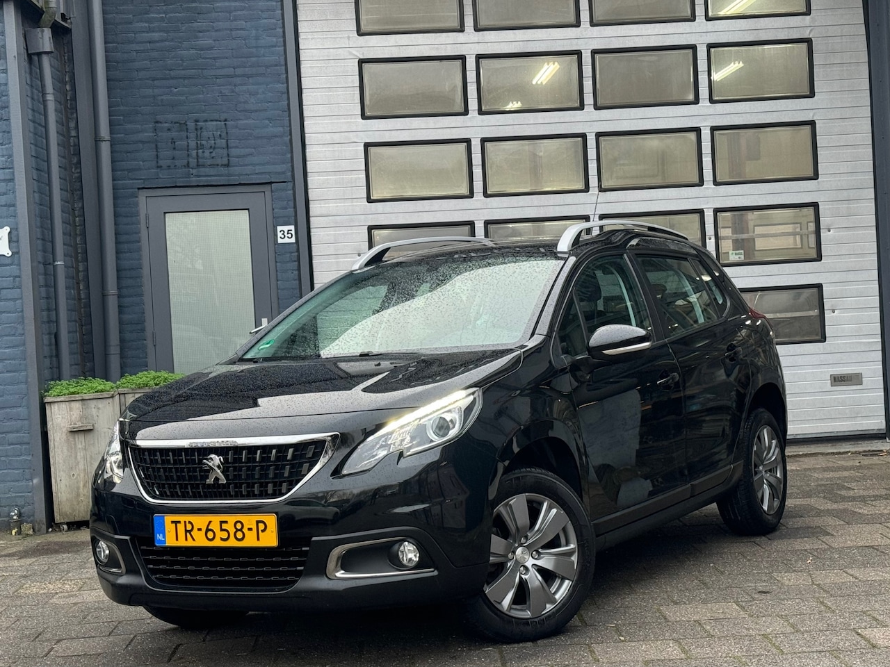 Peugeot 2008 - 1.2 PureTech Blue Lion | Airco | Cruise | Navi | N.A.P - AutoWereld.nl