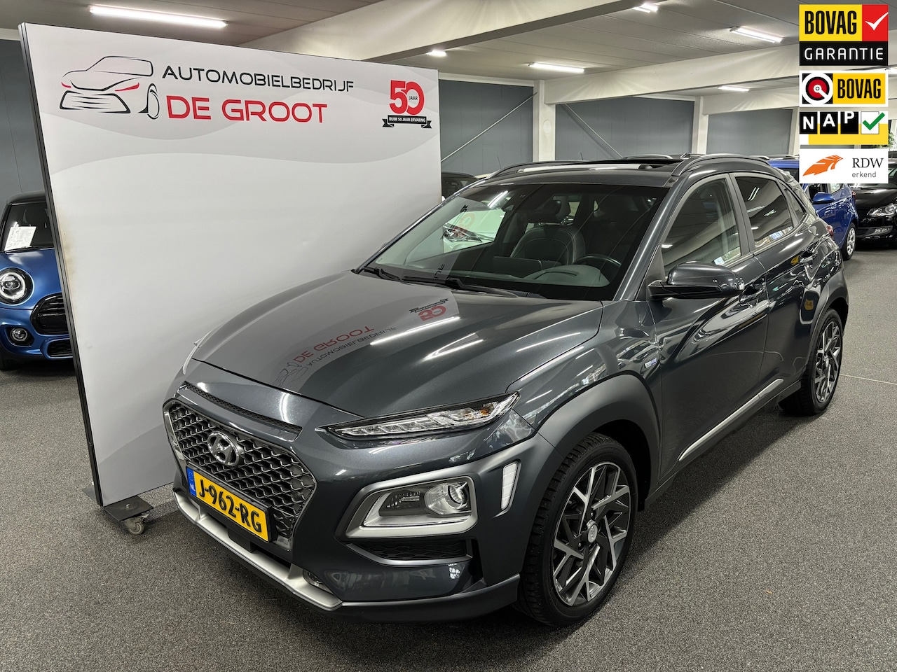Hyundai Kona - 1.6 GDI HEV Premium Sky/ Nederlandse auto/ Eerste eigenaar/ Panoramadak/ LMV/ Lederen bekl - AutoWereld.nl
