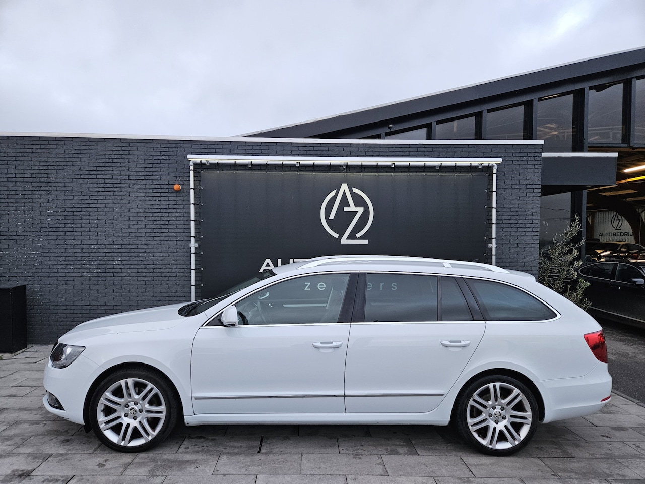 Skoda Superb Combi - 1.6 TDI Sprint Pro *AC*Heatseat*P-assist*Navi - AutoWereld.nl