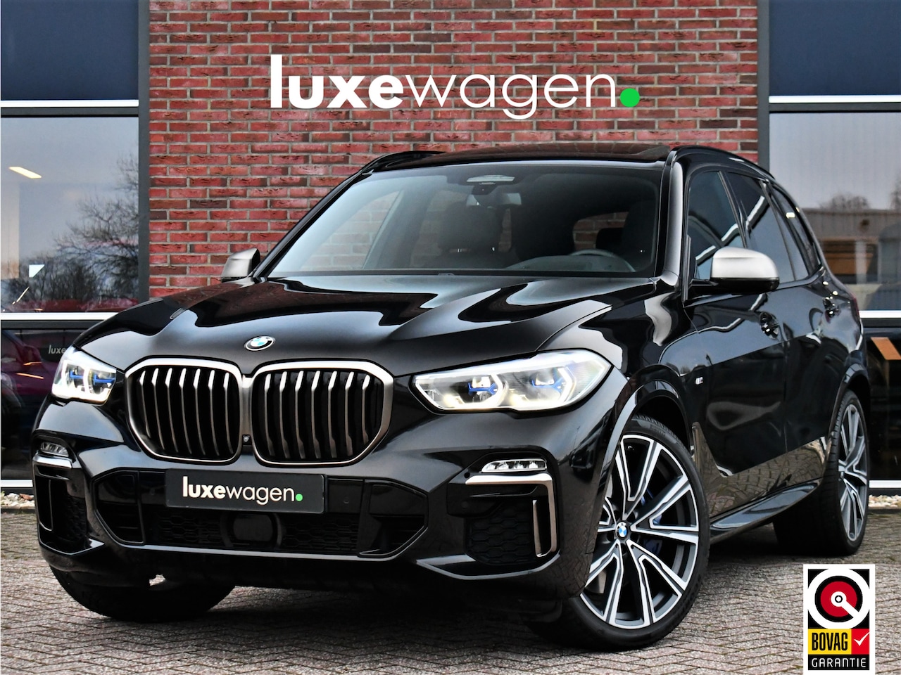 BMW X5 - xDrive40i M-Sport 7pers Pano ACC Trekh 22inch - AutoWereld.nl