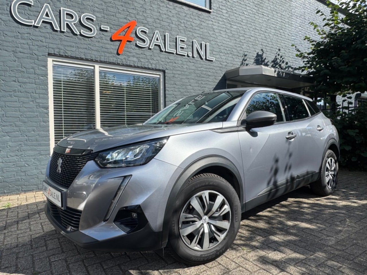 Peugeot 2008 - 1.2 Active Pack + Car-play + LED + Nav + Pdc -  92 dkm! - AutoWereld.nl