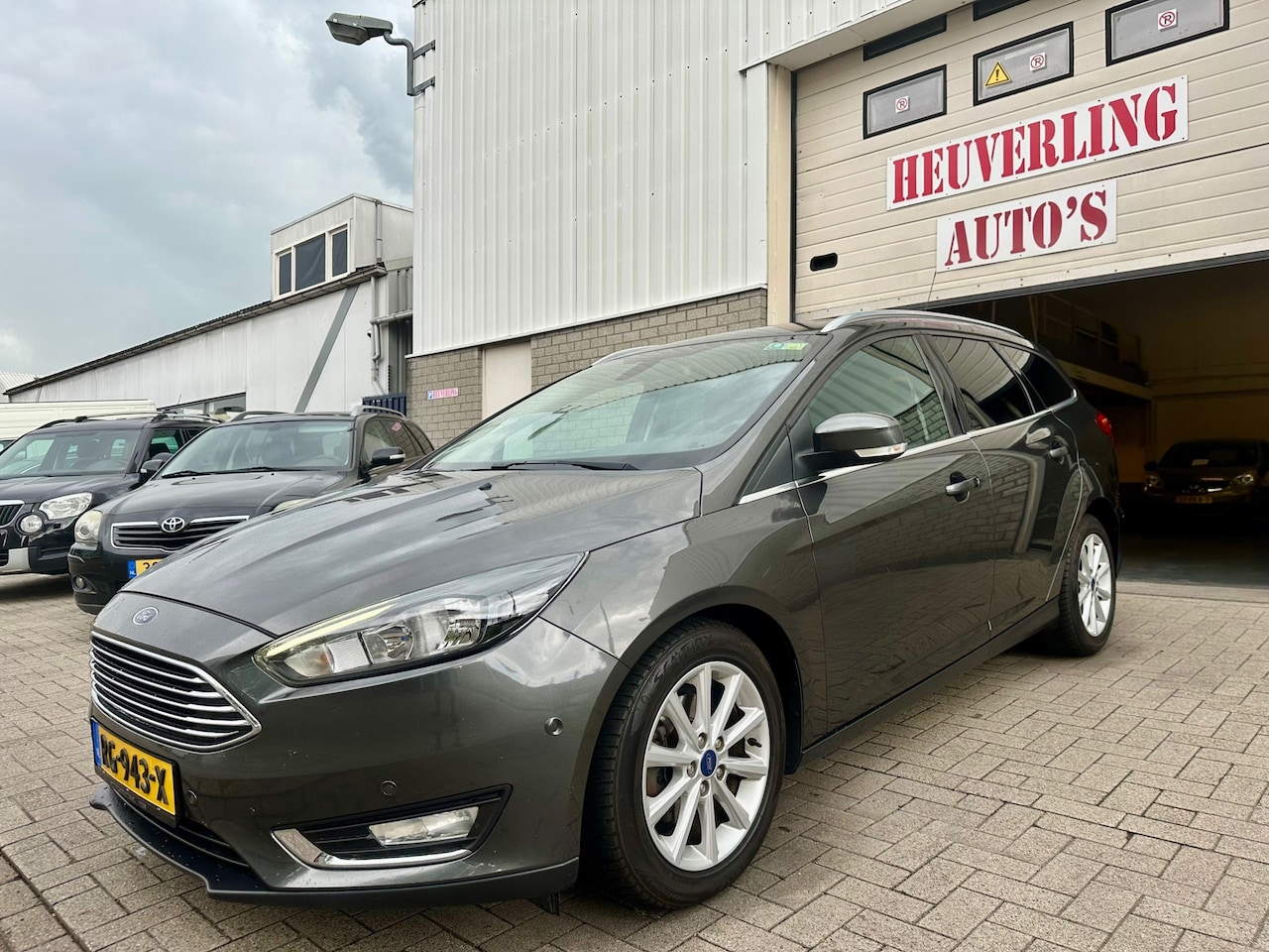 Ford Focus Wagon - 1.0 Titanium | Clima | Navi | Cruise | PDC - AutoWereld.nl