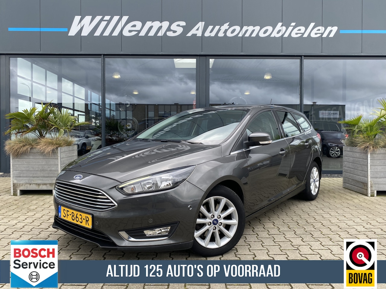 Ford Focus Wagon - 1.5 Titanium Navigatie, Parkeerhulp & Cruise Control - AutoWereld.nl