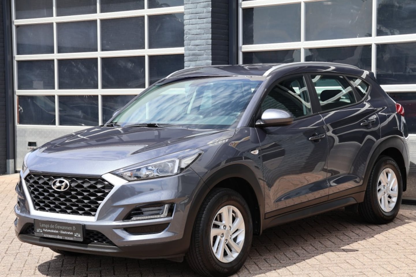 Hyundai Tucson - 1.6 GDI Comfort 1.6 GDI comfort, navigatie, cruise control, camera - AutoWereld.nl