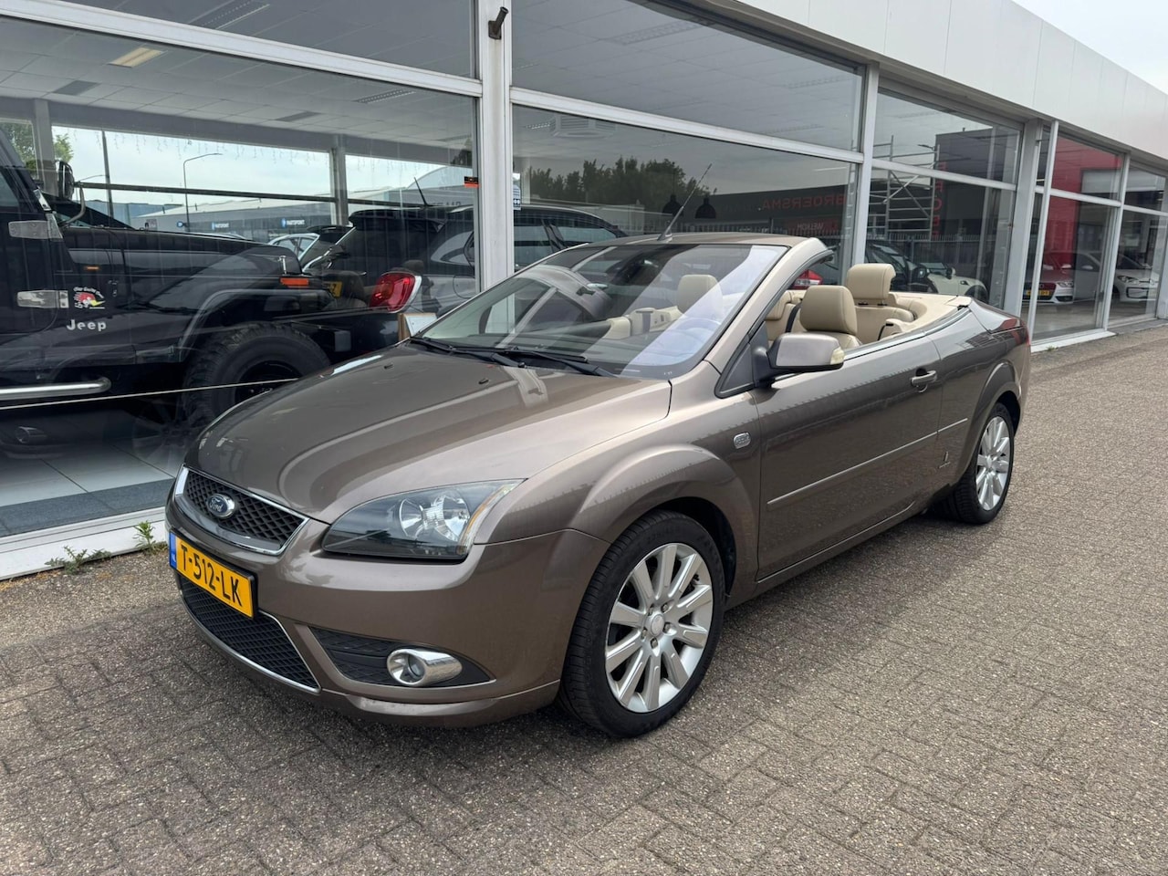 Ford Focus Coupé-Cabriolet - 2.0 TDCi Trend | 3e eigenaar | Leder crème | Navigatie | Airco | Elektrische ramen | Nieuw - AutoWereld.nl