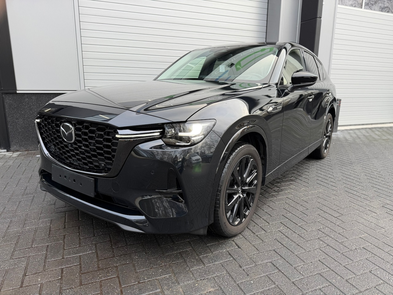 Mazda CX-60 - 2.5 e-SkyActiv PHEV Homura / Panorama / 360 / Trekhaak / Adaptive cruise - AutoWereld.nl
