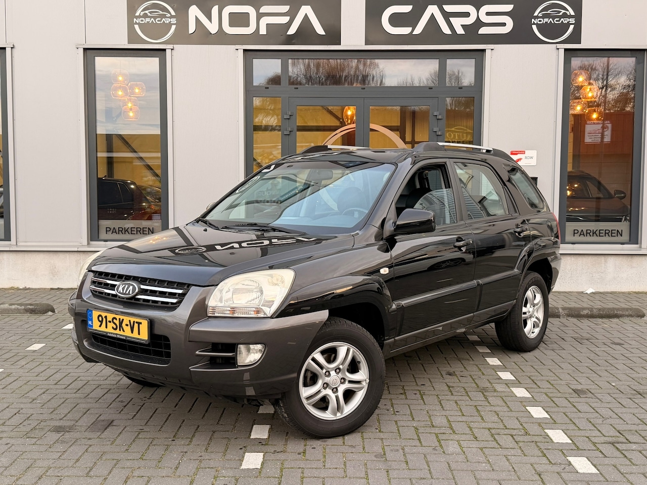 Kia Sportage - 2.0 CVVT Executive|Navi|Trekhaak - AutoWereld.nl