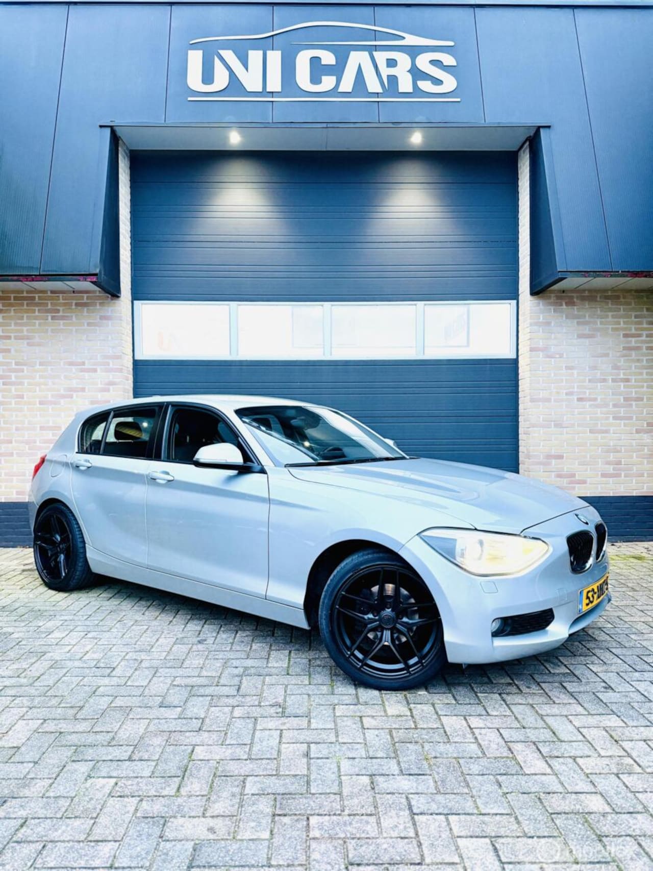 BMW 1-serie - 116i Business+|Automaat|Xenon|Navi|Cruis|LM 18 - AutoWereld.nl