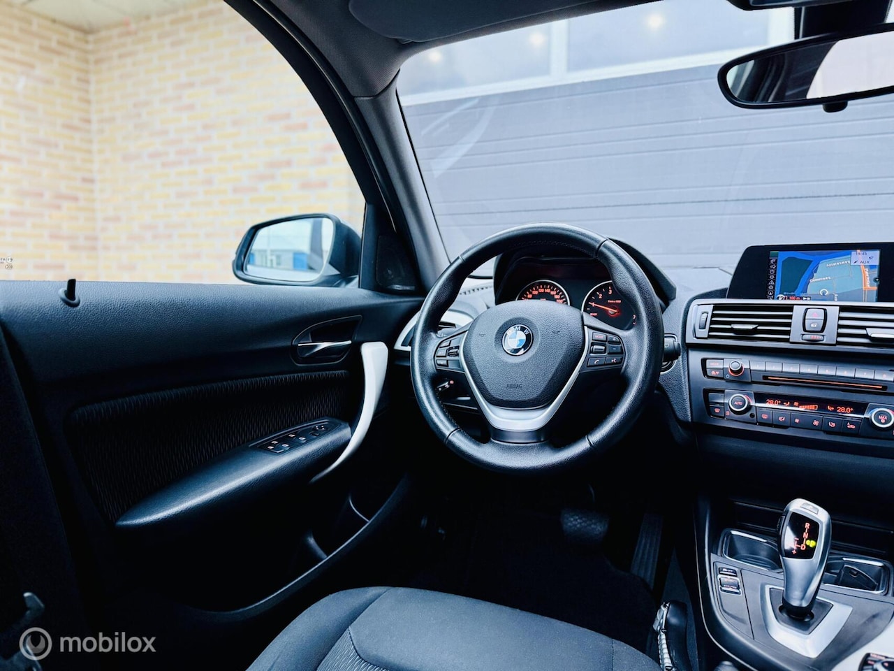 BMW 1-serie - 116i Business+|Automaat|Xenon|Navi|Cruis|LM 18 - AutoWereld.nl