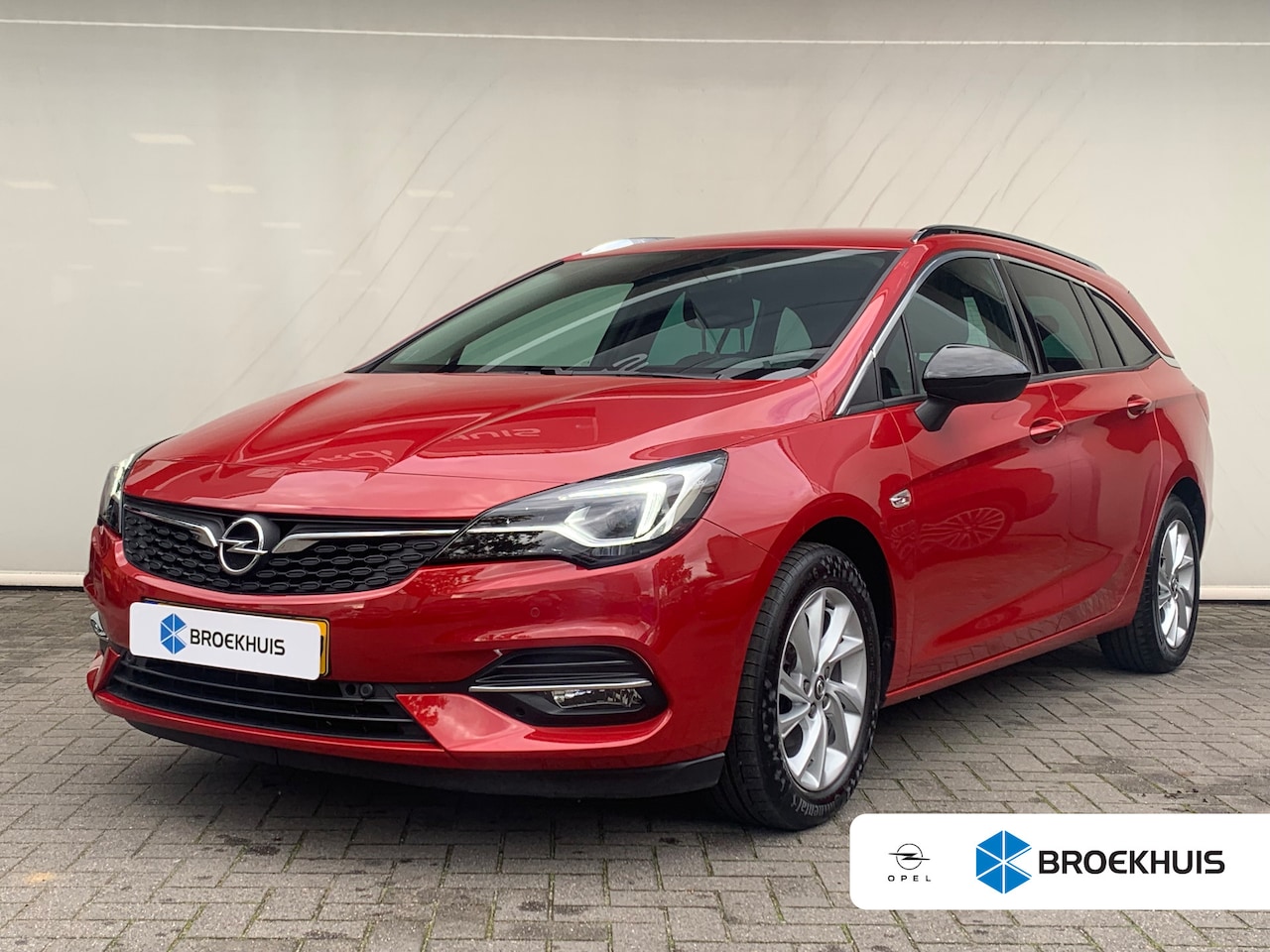 Opel Astra Sports Tourer - 1.2 Business Elegance Airco | Camera | Cruise Control | DAB | Keyless | LED | Navi | PDC V - AutoWereld.nl