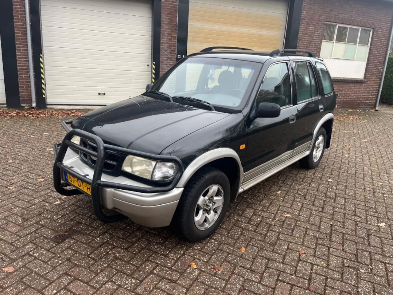 Kia Sportage - 2.0i-16V AIRCO / 4X4 / UNIEK - AutoWereld.nl