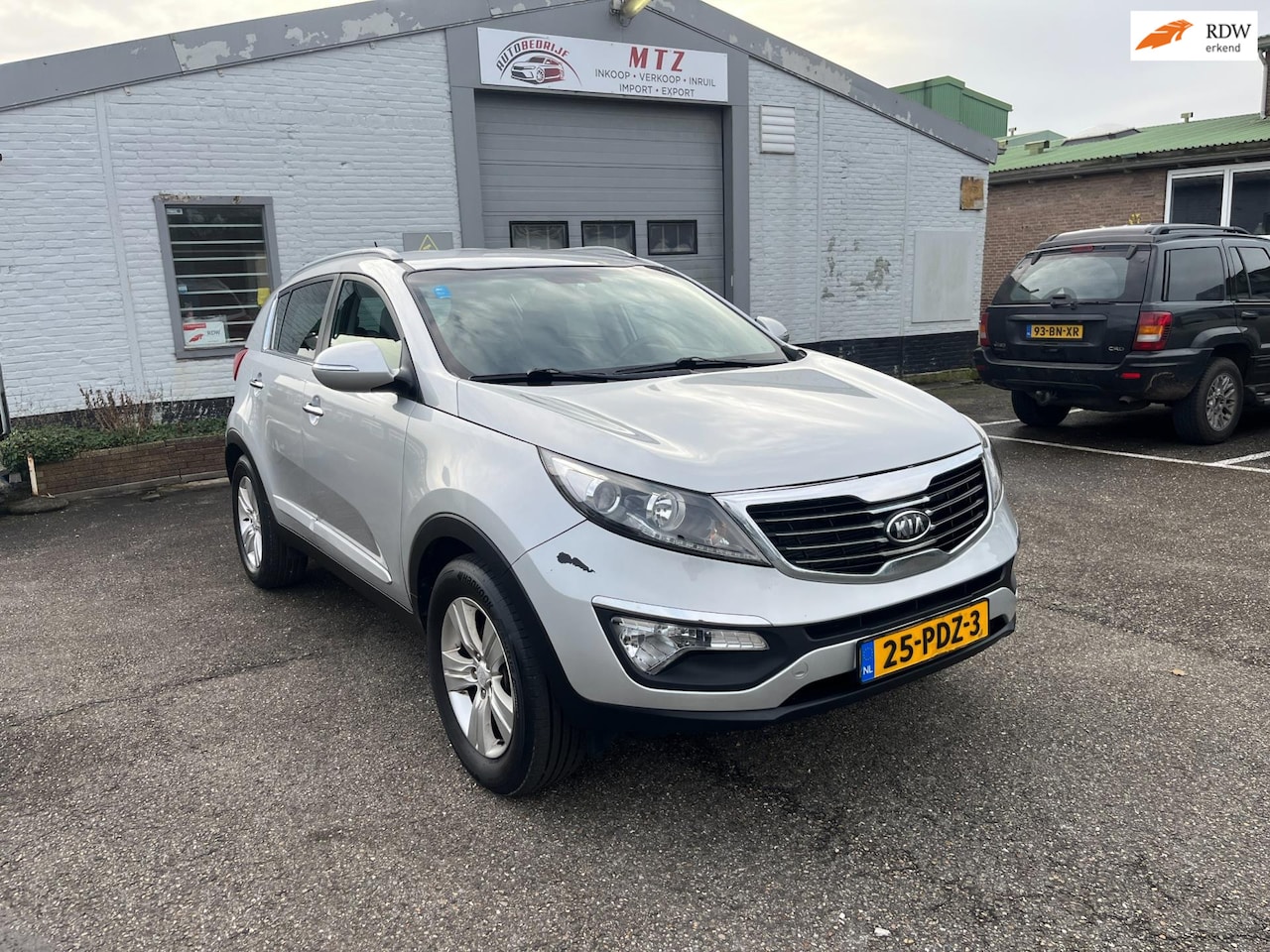 Kia Sportage - 2.0 X-ecutive Plus Pack Climate/ Half Leer/ Trekhaak - AutoWereld.nl