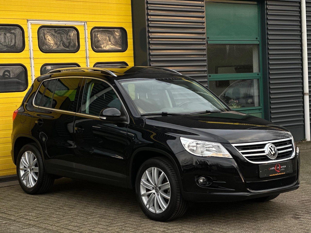 Volkswagen Tiguan - 1.4 TSI Sport&Style 150PK/PDC/CLIMA/ZWART - AutoWereld.nl