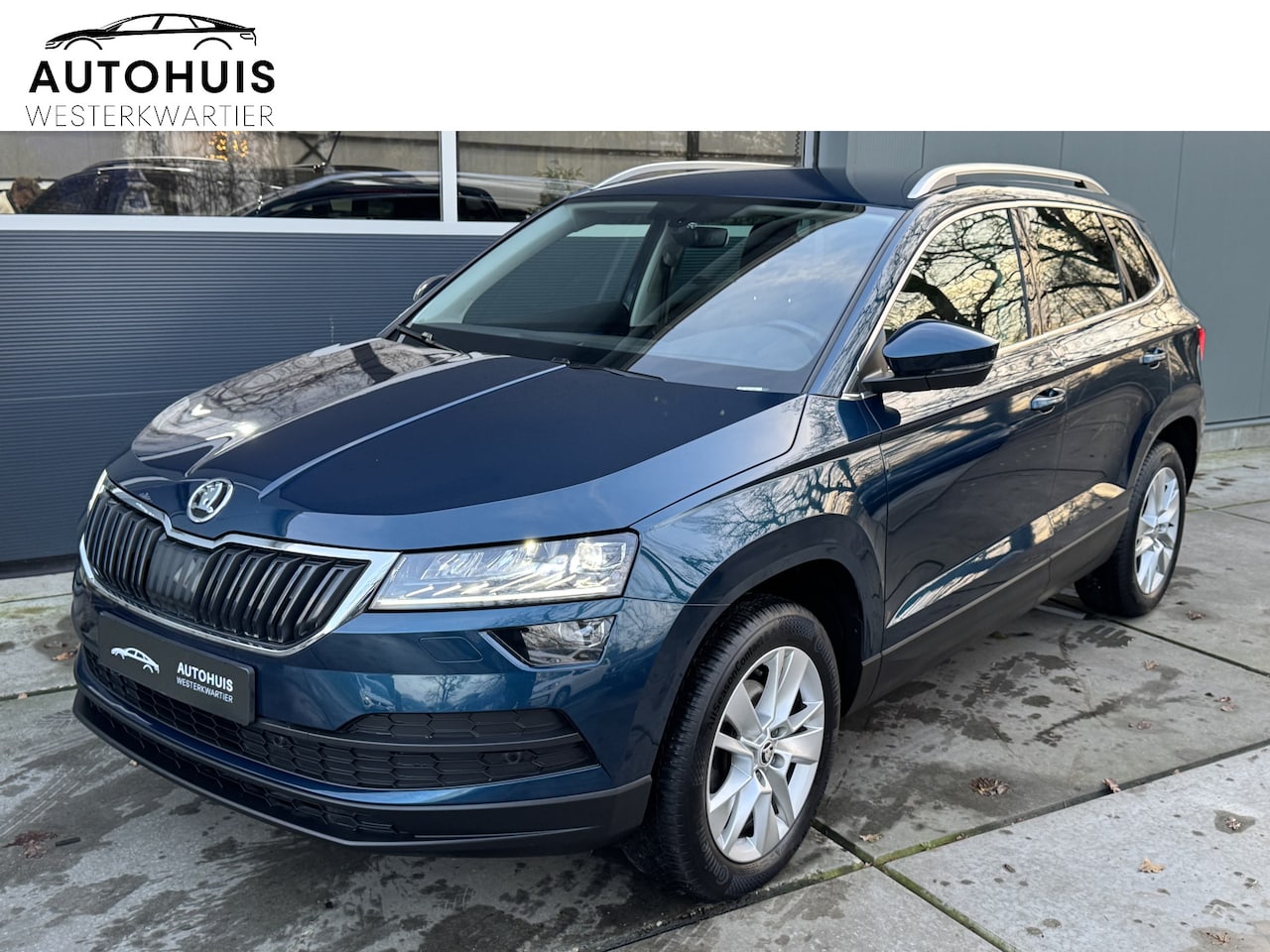 Skoda Karoq - 1.0 TSI 115pk H6 Business Edition Navigatie Stoelverwarming Trekhaak Camera - AutoWereld.nl