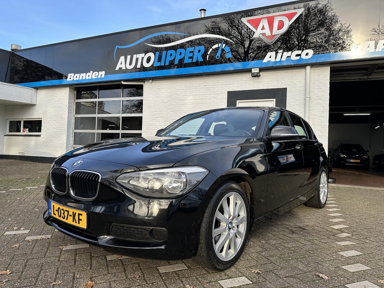 BMW 1-serie - 116i EDE Business /5 drs/Lm velgen/All season banden - AutoWereld.nl