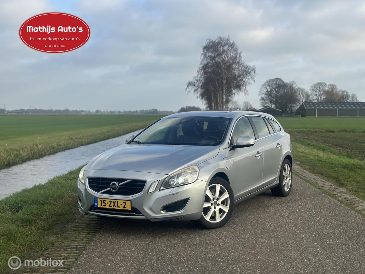 Volvo V60 - 2.4 D6 AWD Plug-In Hybrid Pure Limited nette staat! Goed onderhouden! - AutoWereld.nl