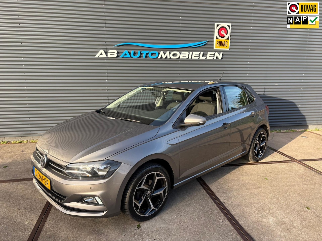 Volkswagen Polo - 1.0 TSI Comfortline NAVI / PDC - AutoWereld.nl