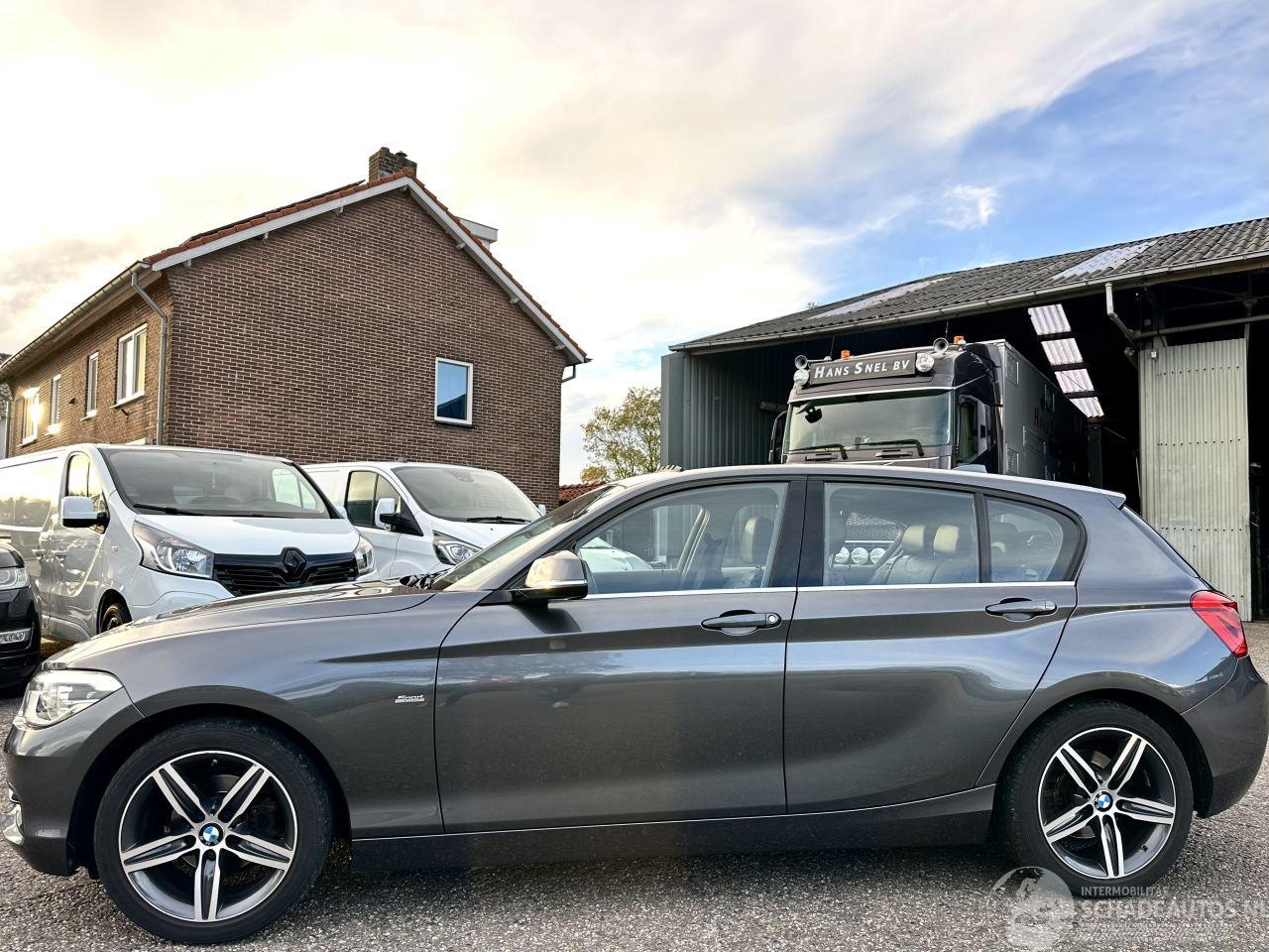 BMW 1-serie - 118i 136pk 6-bak Cent Sportline 5drs - schuifdak - nap - leer - navi - stoelverw - licht + - AutoWereld.nl