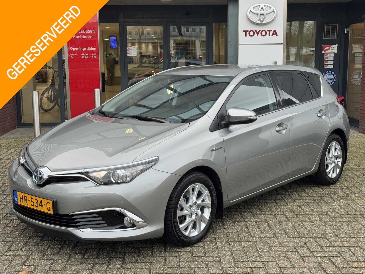 Toyota Auris - 1.8 Hybrid EXECUTIVE TREKHAAK STOELVERW PARK-SENSOREN 4S-BANDEN NAVI CLIMA CRUISE CAMERA K - AutoWereld.nl