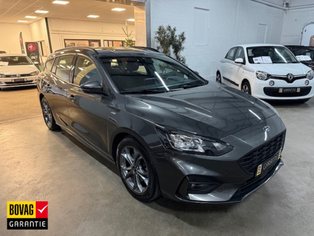 Ford Focus Wagon - 1.0 EBH ST Line. Bns / ECC / NAVI / CAMERA / APPLE CARPLAY - AutoWereld.nl