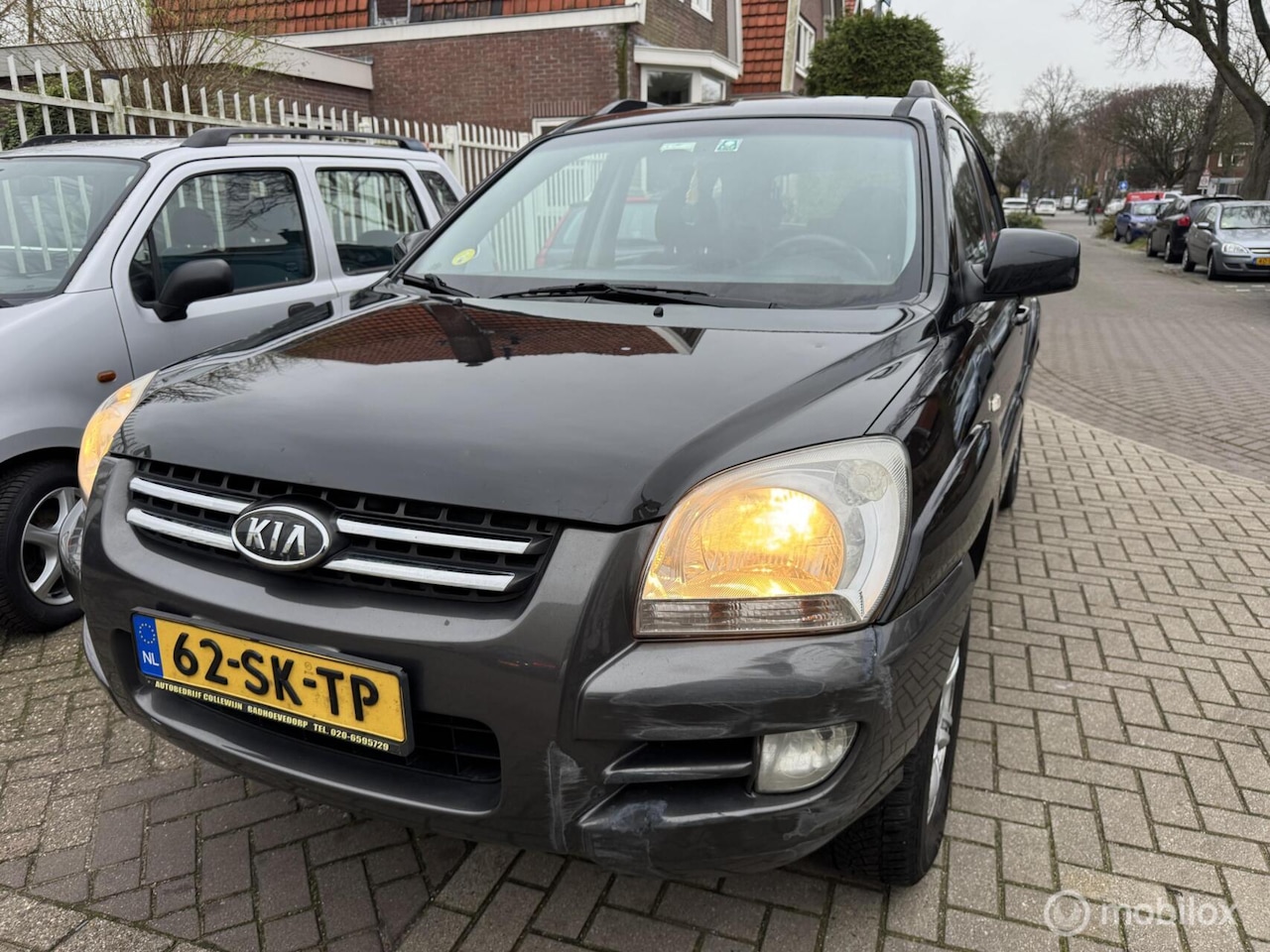 Kia Sportage - 2.0 CVVT Executive 2.0 CVVT Executive - AutoWereld.nl