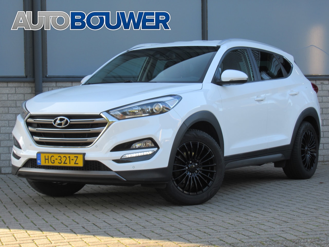 Hyundai Tucson - 1.6 GDi Comfort 2e eigen | dealer onderh | 18"inch velgen | navi | camera | tr.haak - AutoWereld.nl