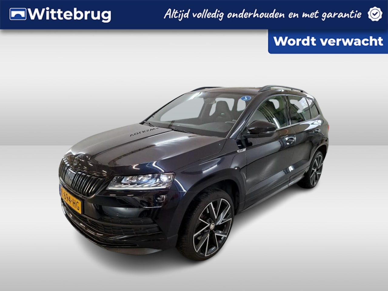 Skoda Karoq - 1.5 TSI ACT Sportline Business / PANO/ STOEL-STUURVERWARM./ CAMERA/ PARK. SENSOREN/ CRUISE - AutoWereld.nl
