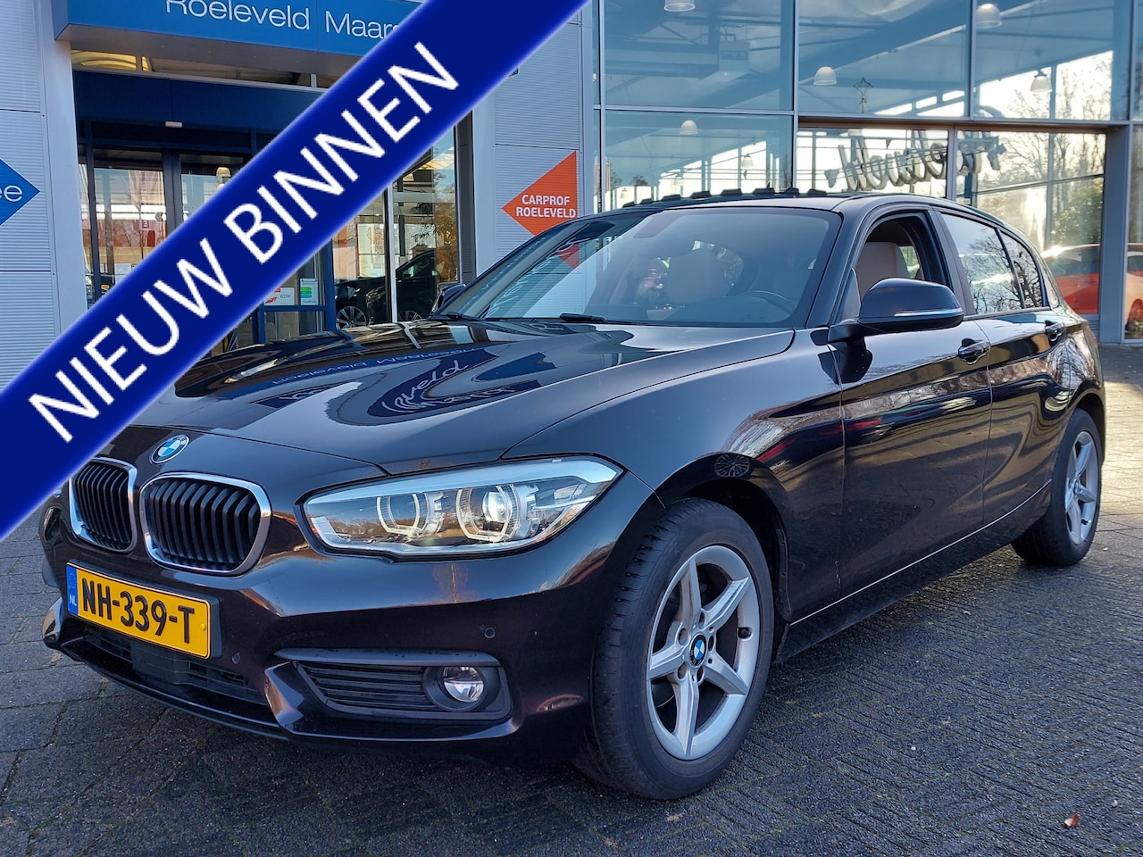 BMW 1-serie - 118i 136pk Automaat High Executive 5-Deurs | Origineel NL | Navi | Clima | Adap.Cruise | H - AutoWereld.nl