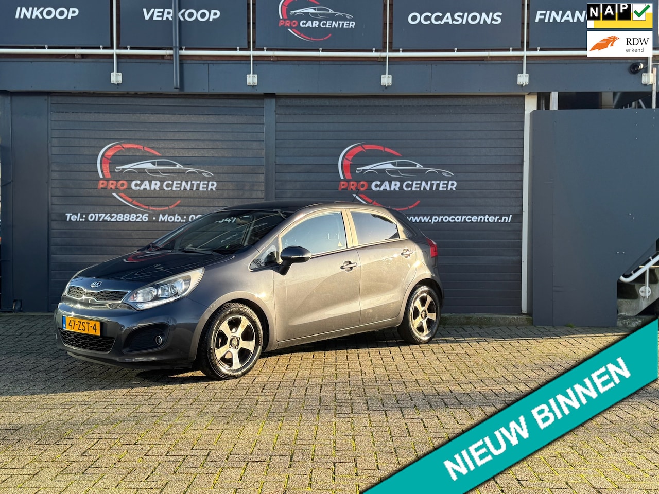 Kia Rio - 1.2 CVVT Design Edition AIRCO|CRUISE|PDC|EL.RAMEN|LMV|NAP|APK - AutoWereld.nl
