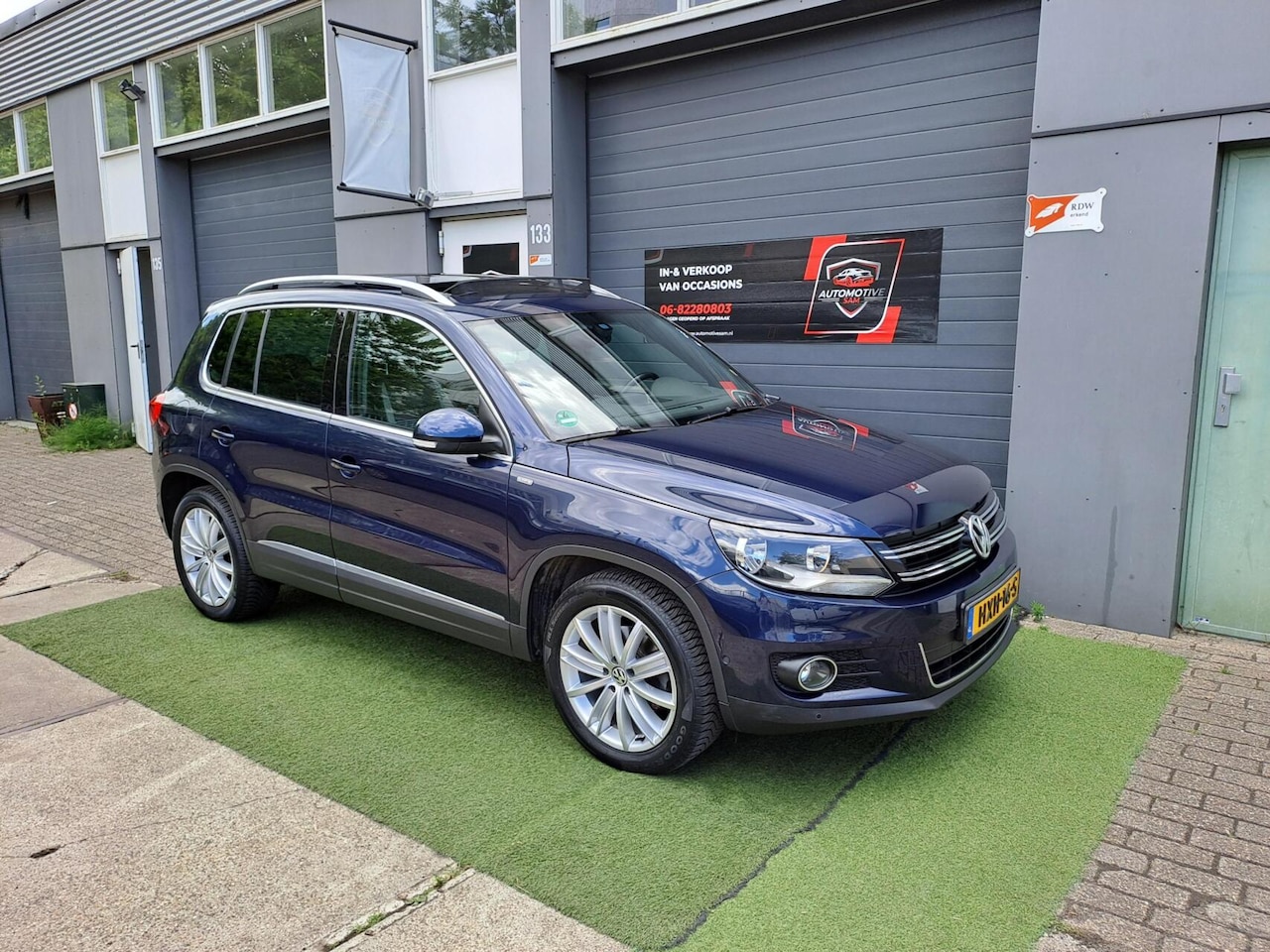 Volkswagen Tiguan - 1.4 TSI Sport&Style Pano Cruise Clima PDC - AutoWereld.nl