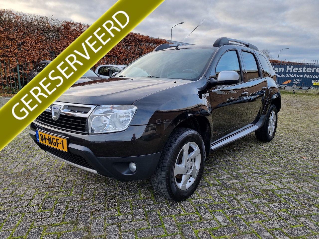 Dacia Duster - 1.6 Lauréate 2wd ✅AIRCO ✅TREKHAAK - AutoWereld.nl