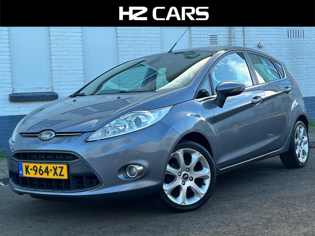 Ford Fiesta - 1.25 Titanium/5drs/Xenon/16"/Clima/Stoelverw./Elektr.pakket - AutoWereld.nl