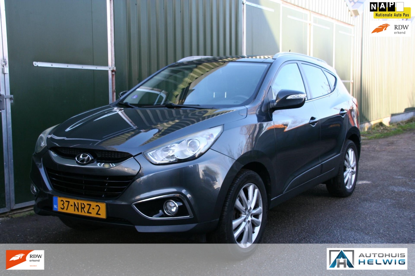 Hyundai ix35 - 2.0i i-Catcher 2.0i i-Catcher, LEER, NAVIGATIE, AIRCO, TREKHAAK, GLAZEN DAK - AutoWereld.nl
