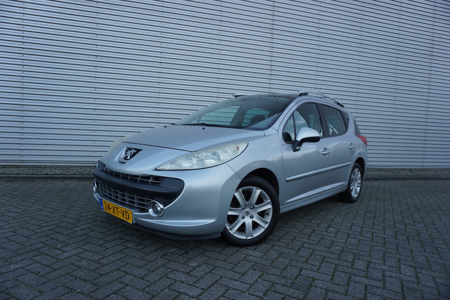 Peugeot 207 SW - 1.6 VTi XS Première Climate / Cruise / Elektr. ramen / Trekhaak / Lm velgen / NAP - AutoWereld.nl