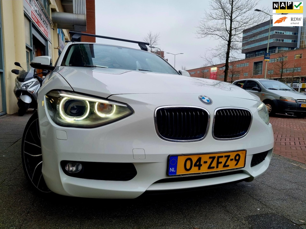 BMW 1-serie - 114i Business+ Navi Airco ElecRam xenon - AutoWereld.nl