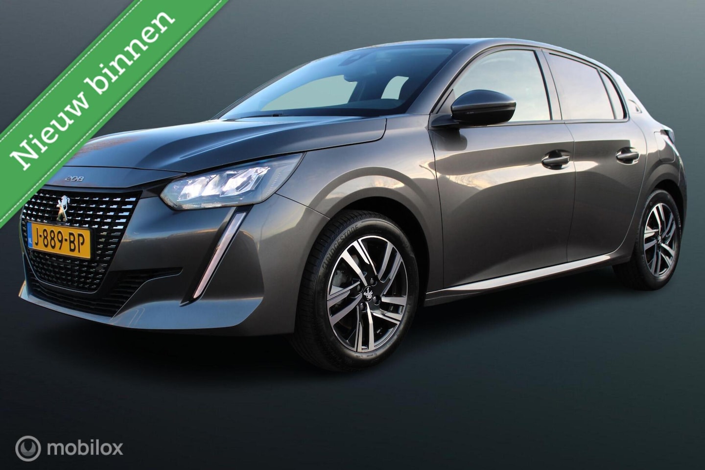 Peugeot 208 - 1.2 100 PK Turbo PureTech Blue Lease Allure, Trekhaak, Donker glas, Pdc + Camera, Cruise, - AutoWereld.nl