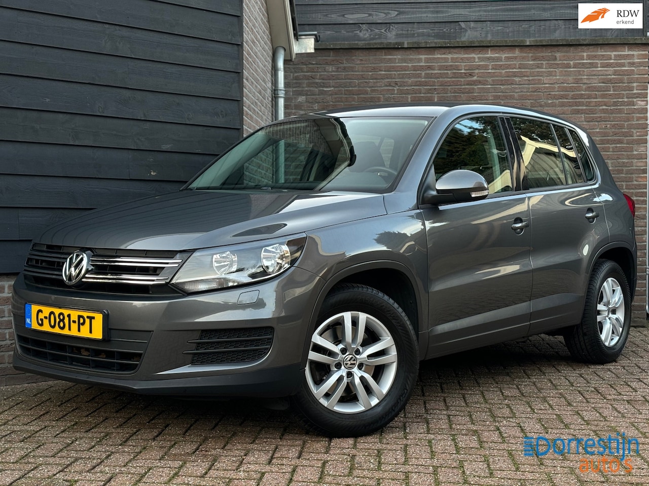Volkswagen Tiguan - 1.4 TSI Sport&Style | Trekhaak | Navi | PDC | Cruise | Stoelverwarming - AutoWereld.nl