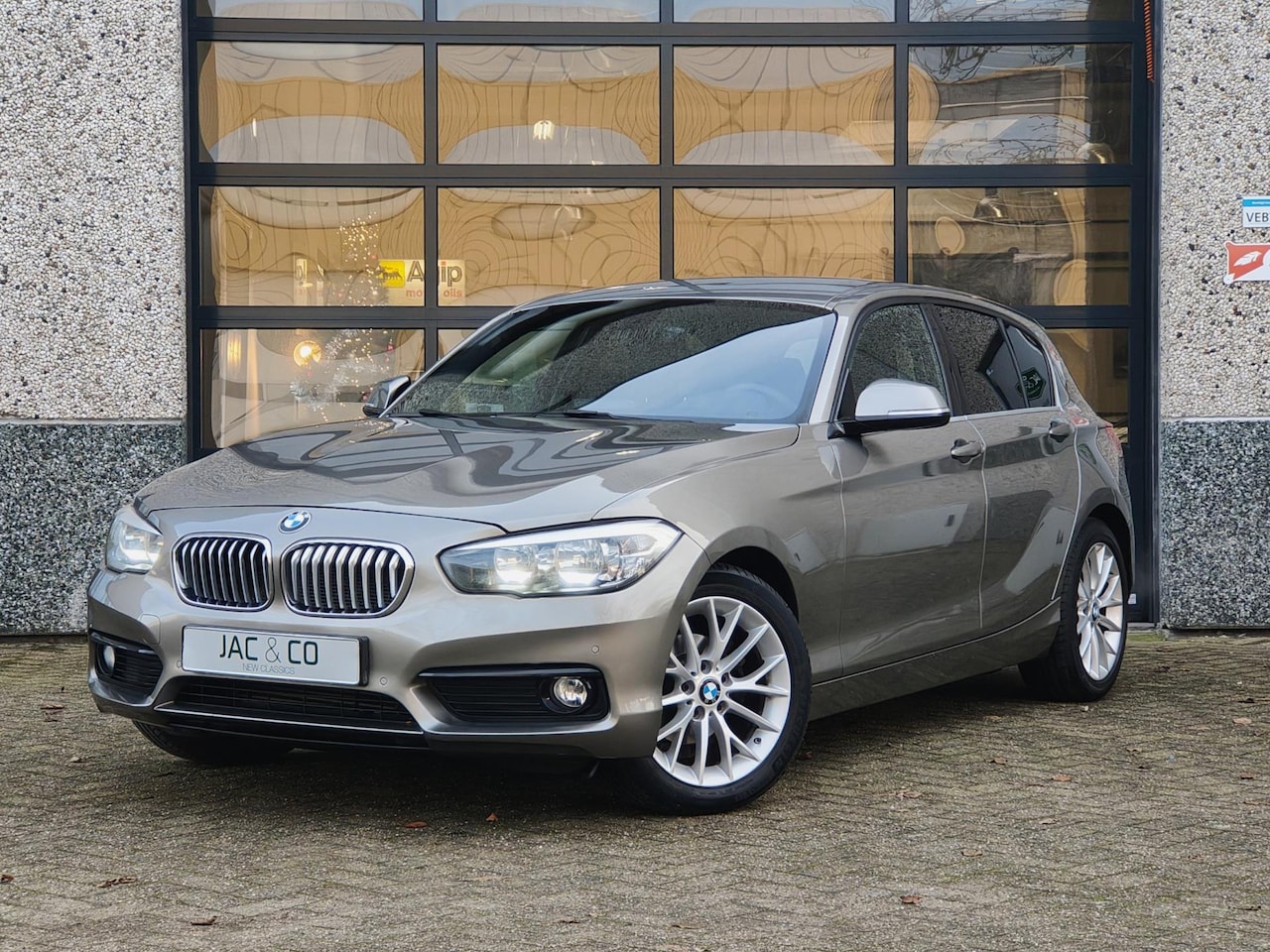 BMW 1-serie - 116i High Executive Half leer - Trekhaak - AutoWereld.nl