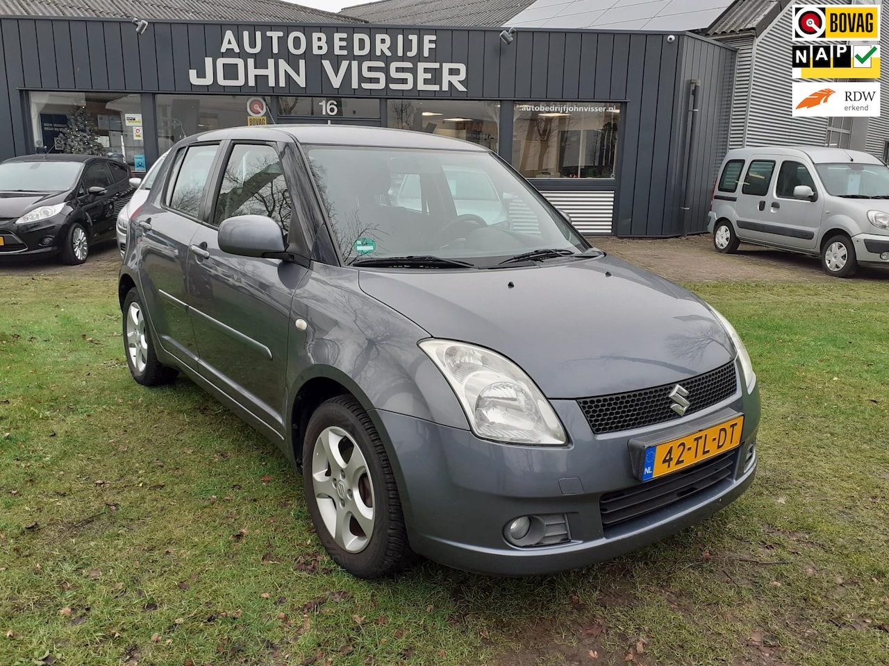 Suzuki Swift - 1.3 4Grip Exclusive * 4-wheeldrive * airco * - AutoWereld.nl