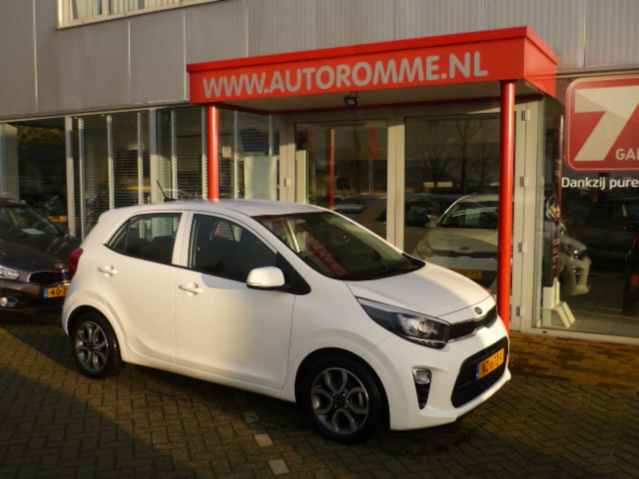 Kia Picanto - 1.0 5-zits First Edition 59.000km navi clima cruise - AutoWereld.nl