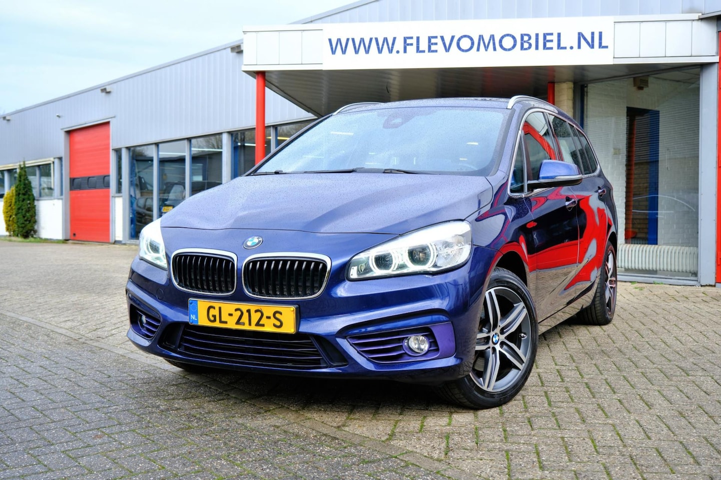 BMW 2-serie Gran Tourer - 218i Sport 7-pers Aut. *69.580km!* Navi|Leder|Sportstoelen|HUD|Clima|LMV - AutoWereld.nl