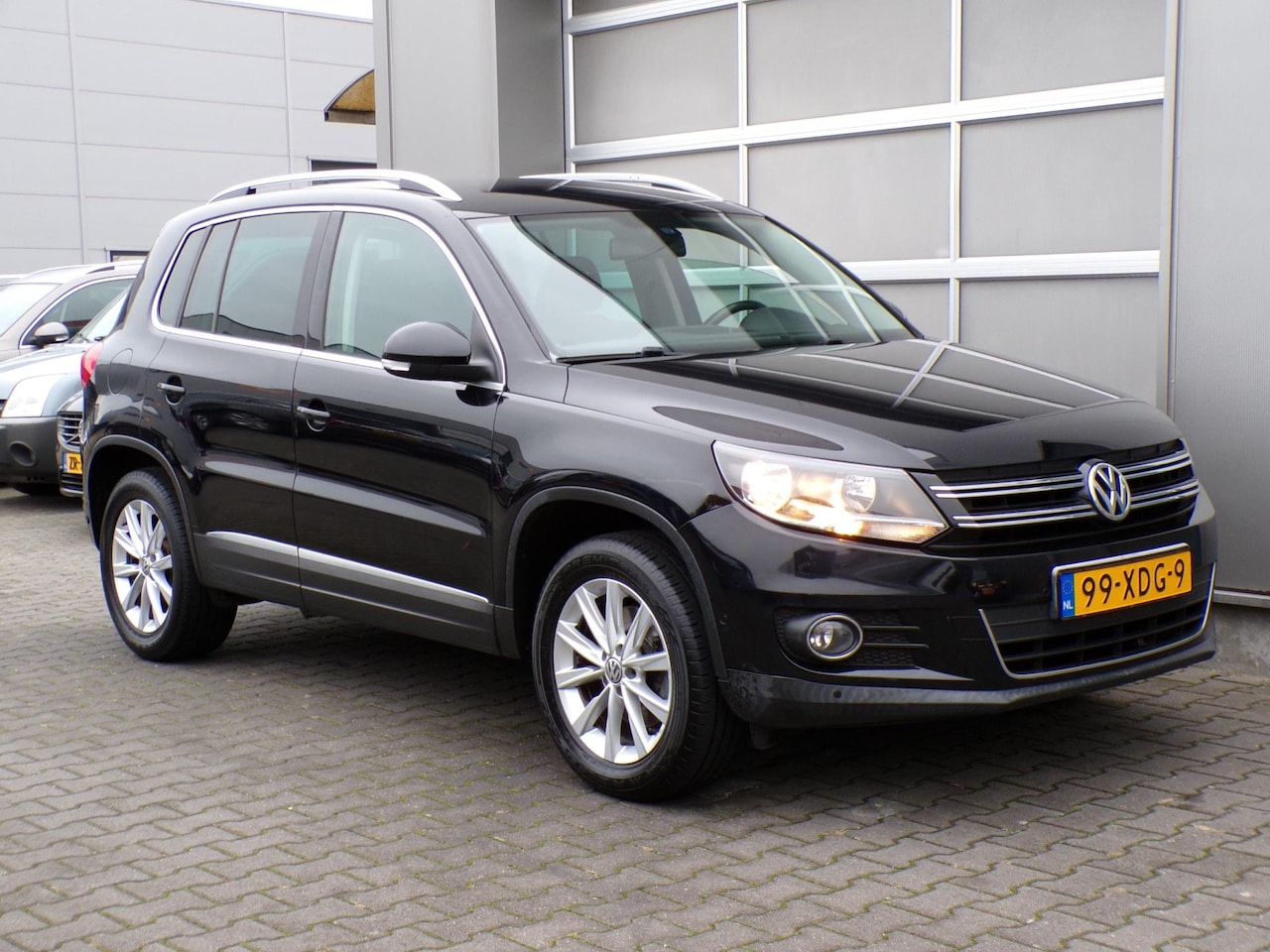 Volkswagen Tiguan - 1.4 TSI Sport&Style Clima/Cruise/PDC/Navi!! - AutoWereld.nl