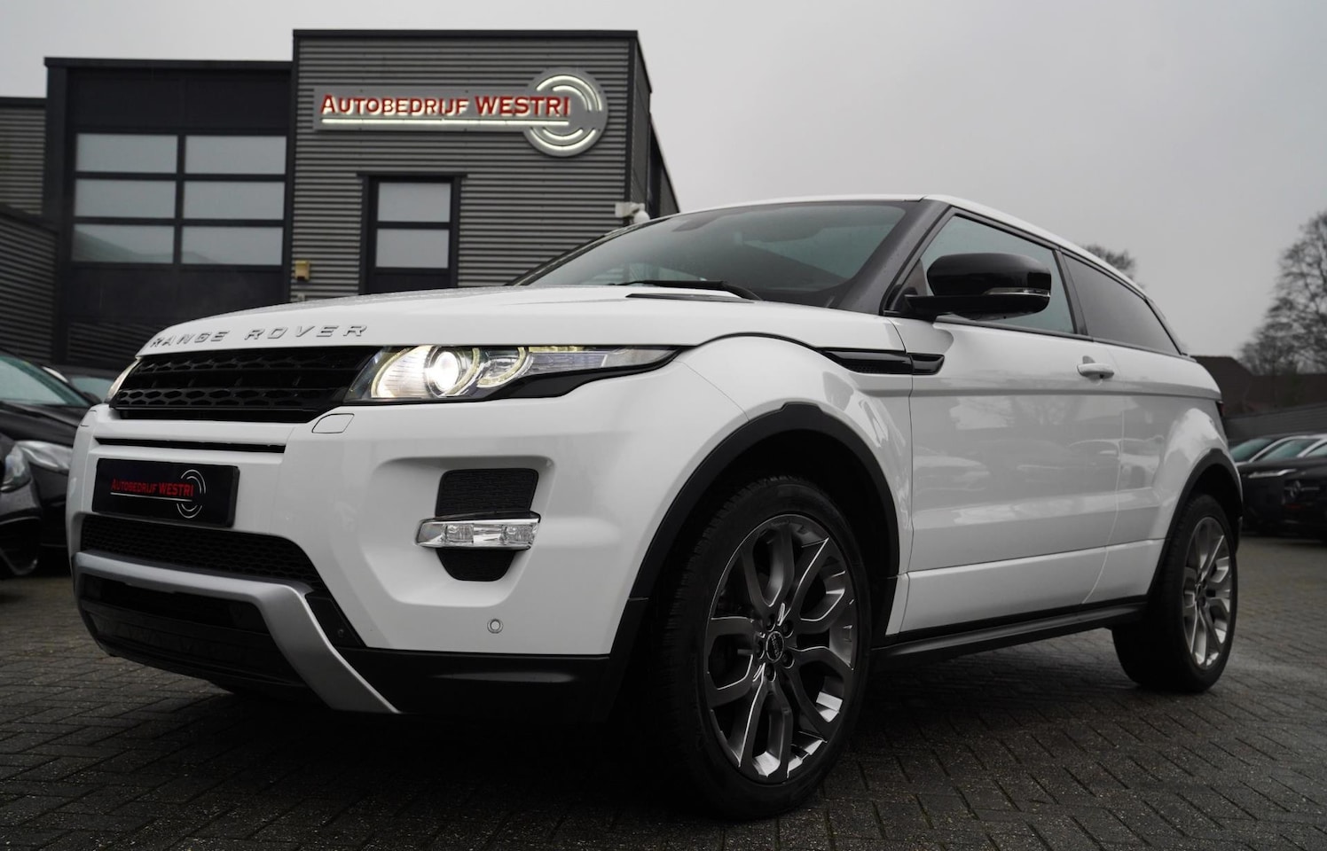 Land Rover Range Rover Evoque Coupé - 2.0 Si 4WD Prestige | Panorama | 241PK | Meridian | Memory stoelen | Camera | Stoelverwarm - AutoWereld.nl