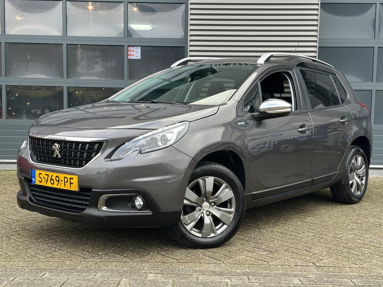 Peugeot 2008 - 1.2 PureTech Allure | Navi | CRUISECR | PDC - AutoWereld.nl
