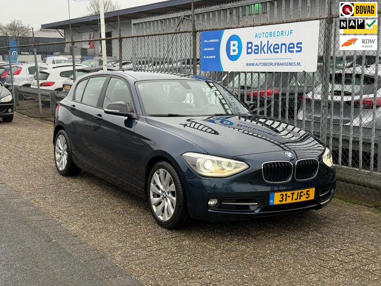 BMW 1-serie - 118i Business | Airco | Cruise | Navi | Bluetooth - AutoWereld.nl