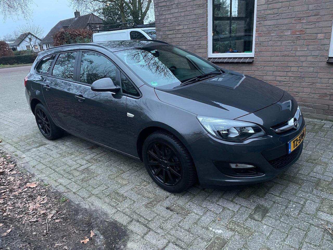 Opel Astra Sports Tourer - 1.4 airco sportvelgen - AutoWereld.nl
